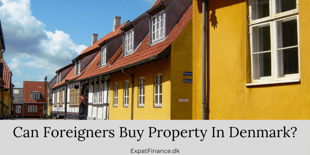 Row of traditional yellow and timber-framed Danish houses under a blue sky, with text asking if foreigners can buy property in Denmark.