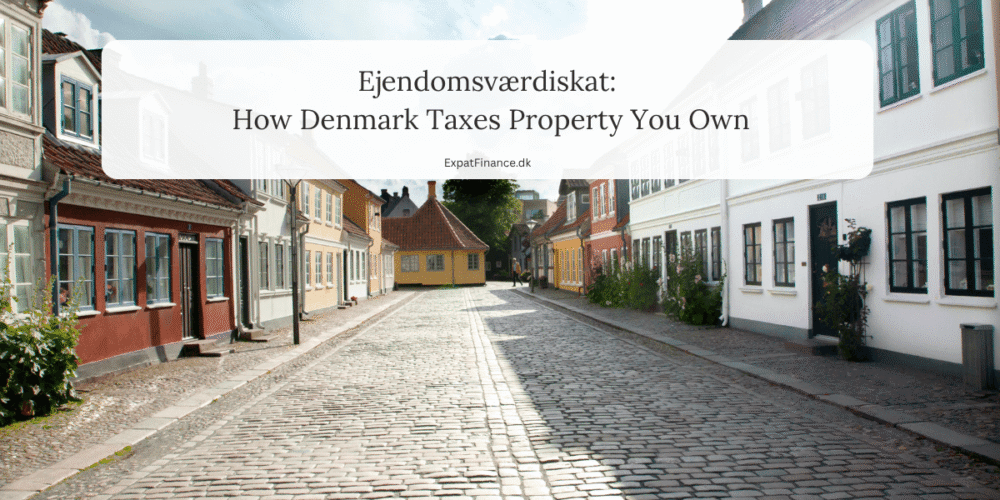 Cobblestone street lined with colorful Danish houses featuring text overlay: Ejendomsværdiskat: How Denmark Taxes Property You Own